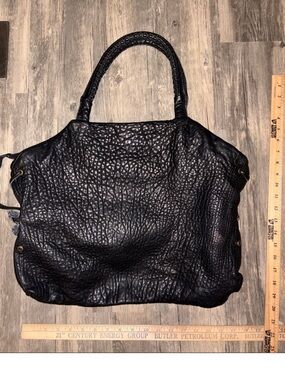Handmade leather Y2K style hobo handbag retail is 399.00